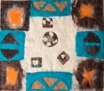 Symmetrical felt collage with vivid turquoise framing, stitched dark brown forms, and embedded ceramic tiles arranged across a white wool background — balancing tactile softness with decorative precision.