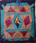 Felt piece inspired by architectural symmetry, with stitched diamonds in blue, grey, and magenta surrounded by thick turquoise borders, resembling a stylized nomadic structure.