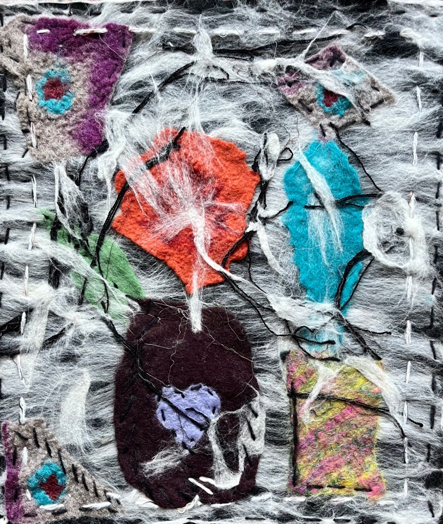 Collage of layered felt vessels and abstract flowers beneath a web of white wool fibers, combining vivid forms in red, turquoise, and violet with stitched details on a grey base.