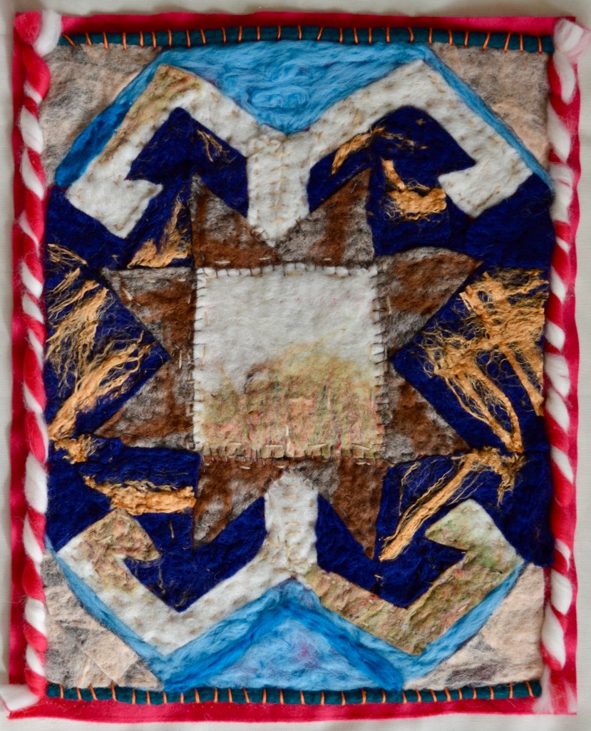 Felt collage inspired by Persian carpet motifs, featuring a central rectangular field flanked by angular mountain-like forms and triangular star shapes, framed by red and white twisted yarn — a richly textured homage to woven memory and sacred geometry.