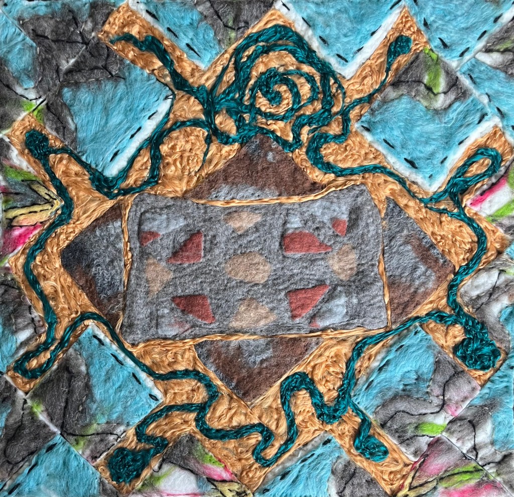 Felt composition with golden tan diamond shape outlined in teal, set against a sky-blue textured background, inspired by woven motifs and abstract architecture.